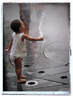 Kid playing with water #1