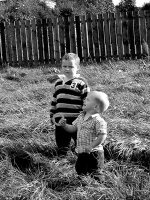 my two granchildren playing with a kite