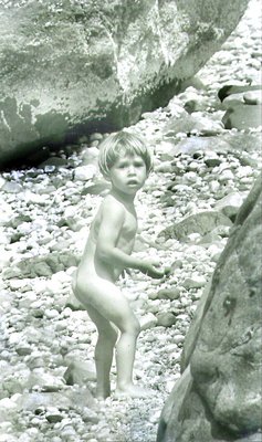 Boy between boulders