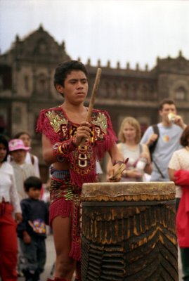 A young Aztec learns to play the cerimonial drums.