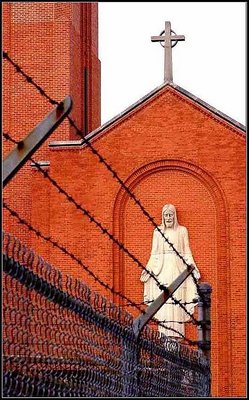God behind barbed wire