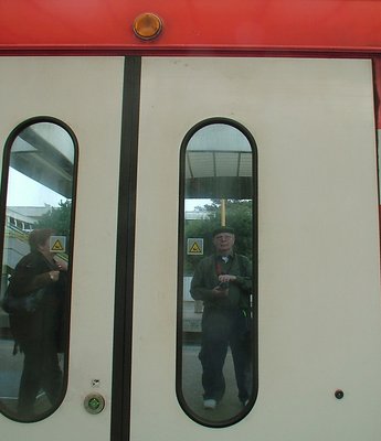 Autoportrait reflected in train-door 