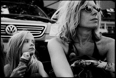 a ice , a girl , her mother and a car