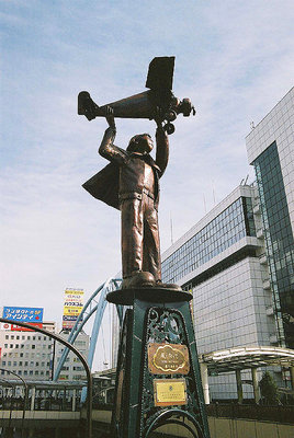 Statue of Boy with Airplane