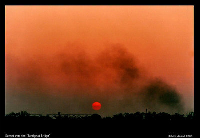 The sun sets over the Saraighat bridge