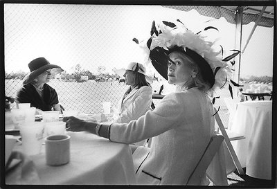 woman with feathery hat 