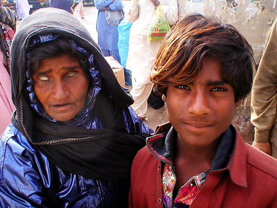 Blind faqir with her son 