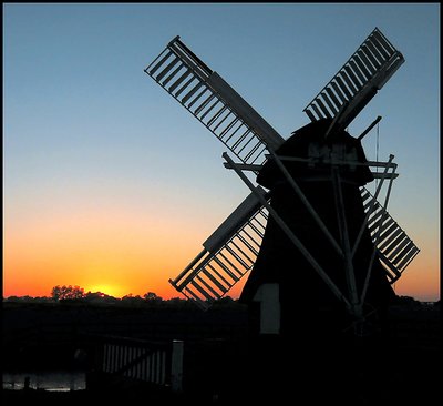 Mill by sunset in silhouet