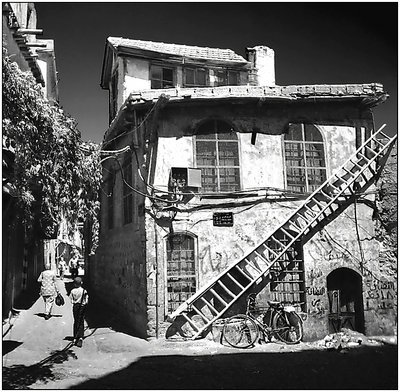 house with ladder and bike