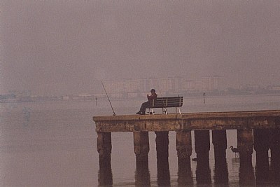 "Fisherman On Pier"