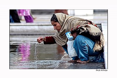 Drinking Holy water.