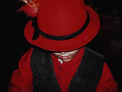 mistery man with red hat