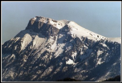 Peak and slopes under snow