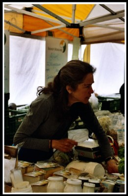 Working woman at the cheese market