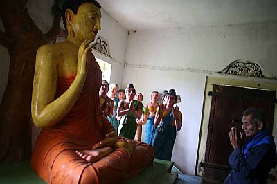 Devotee among statues