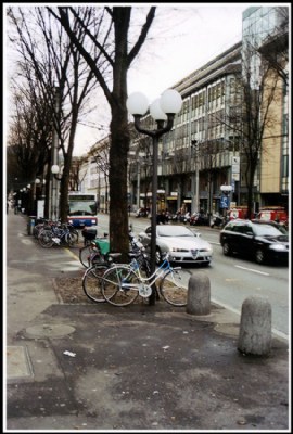 The parked bicycles along the road