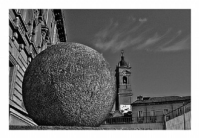 a Big stone-ball vs Bell tower