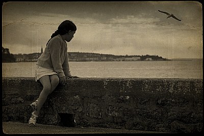 A little girl watching sunset