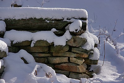 snow wood and rocks