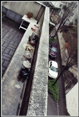 Rain over balcony over street