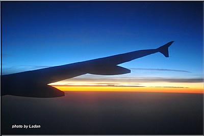 sunrise on the wing of airplane