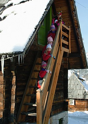 Children on a wooden staircase