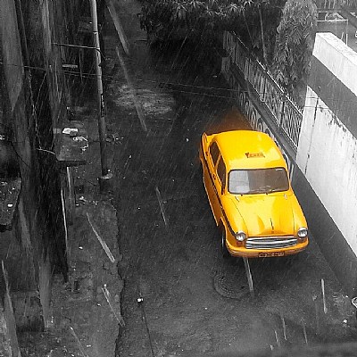The yellow taxi in the rain 