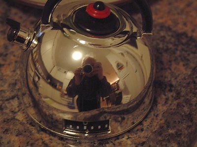 Self portrait reflected from kettle