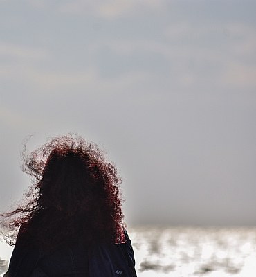 Red girl in the wind