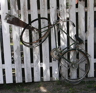 BICYCLE ON A FENCE