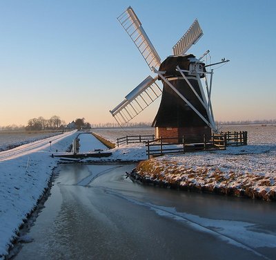 Mill in sunset .