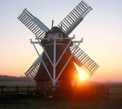 Watermill in Silhouette by sunset