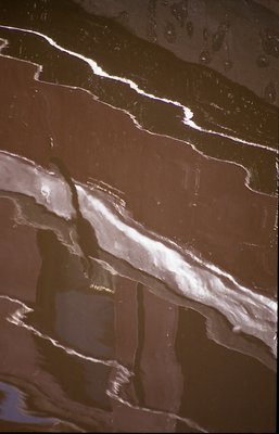 reflection of part of boat in water