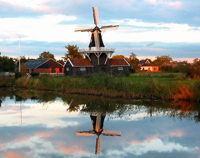 Mill  in sunsetlight and reflection