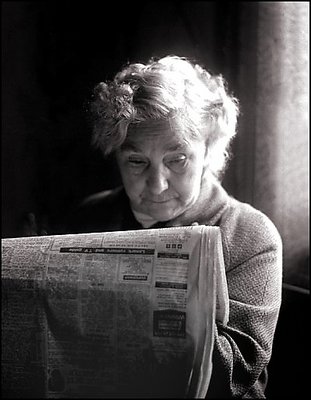 Old lady with newspaper